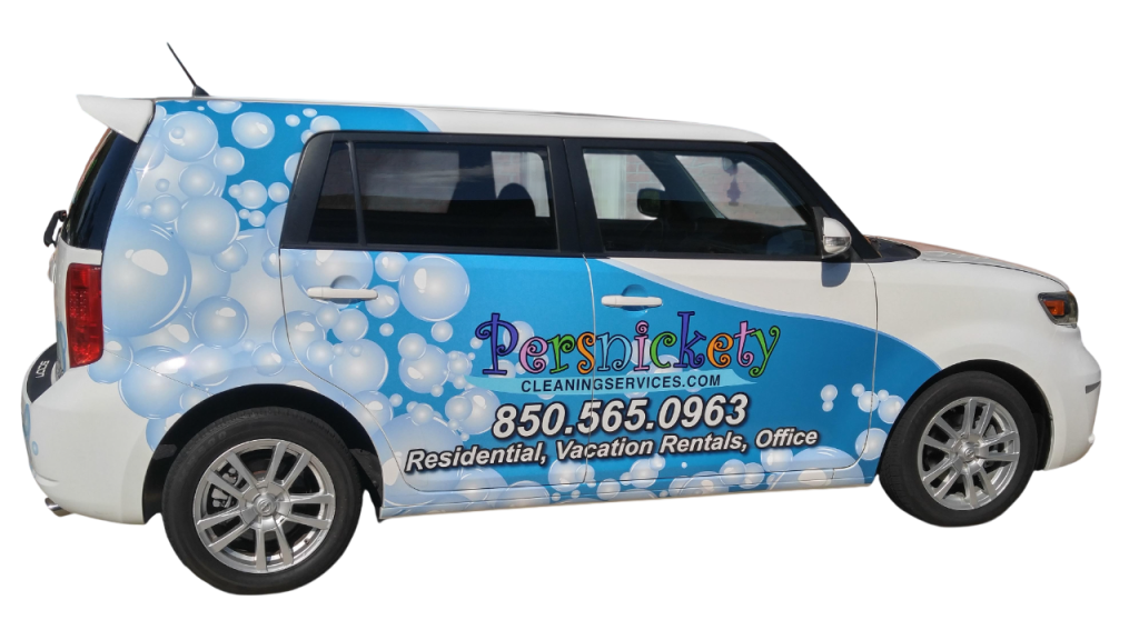 A white car with a vibrant bubble-themed wrap advertising a cleaning service. Large text displays the company name, contact number, and services offered.